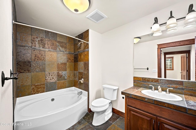 2151 N Main St # 226, Coeur Dalene, ID 83814 - bathroom with toilet, baseboards, bathing tub / shower combination, visible vents, and stone tile flooring