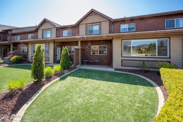 2151 N Main St # 226, Coeur Dalene, ID 83814 - view of property with a patio area and a front yard