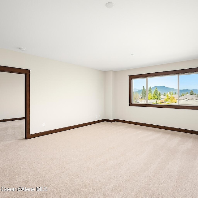 2151 N Main St # 226, Coeur Dalene, ID 83814 - empty room featuring baseboards and light carpet