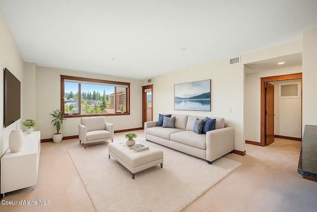 2151 N Main St # 226, Coeur Dalene, ID 83814 - living room featuring baseboards, light carpet, and visible vents