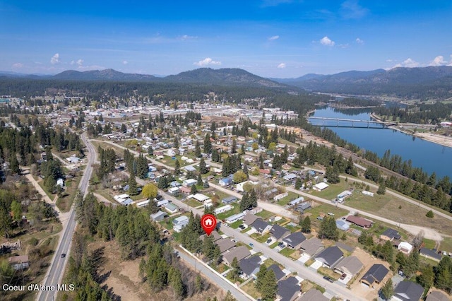 635 E Valley St, Oldtown, ID 83822 - drone / aerial view featuring a residential view and a water and mountain view