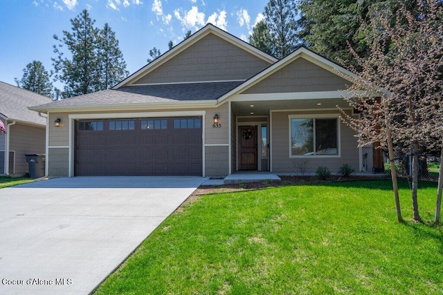 635 E Valley St, Oldtown, ID 83822 - view of front of property featuring a garage, concrete driveway, a porch, and a front lawn
