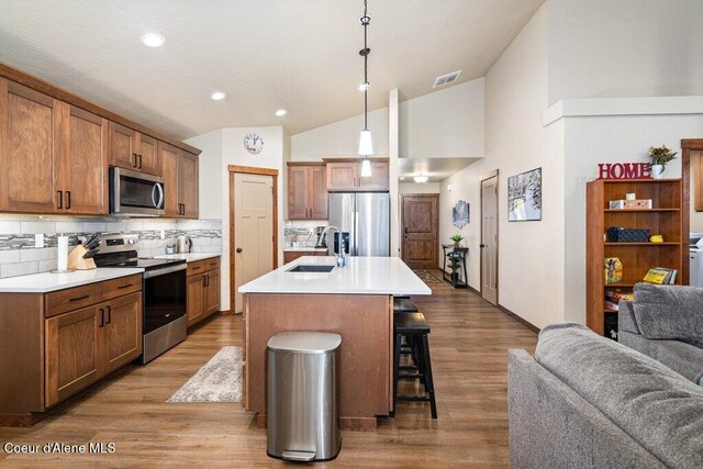 635 E Valley St, Oldtown, ID 83822 - kitchen featuring visible vents, appliances with stainless steel finishes, a sink, lofted ceiling, and open floor plan