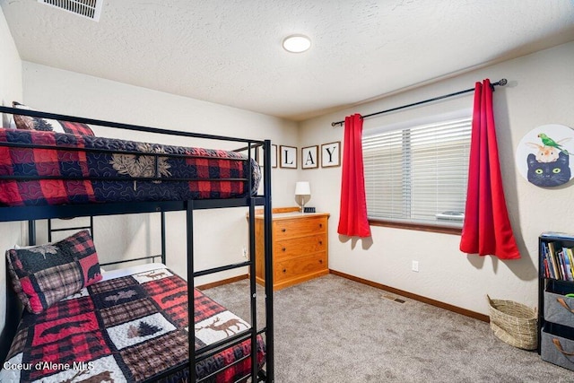 635 E Valley St, Oldtown, ID 83822 - carpeted bedroom featuring baseboards, a textured ceiling, and visible vents