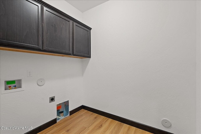 laundry area with baseboards, hookup for a washing machine, light wood-type flooring, gas dryer hookup, and electric dryer hookup