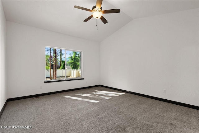 unfurnished room with baseboards, carpet flooring, a ceiling fan, and vaulted ceiling