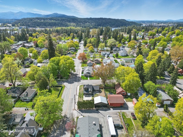 birds eye view of property with a mountain view and a residential view