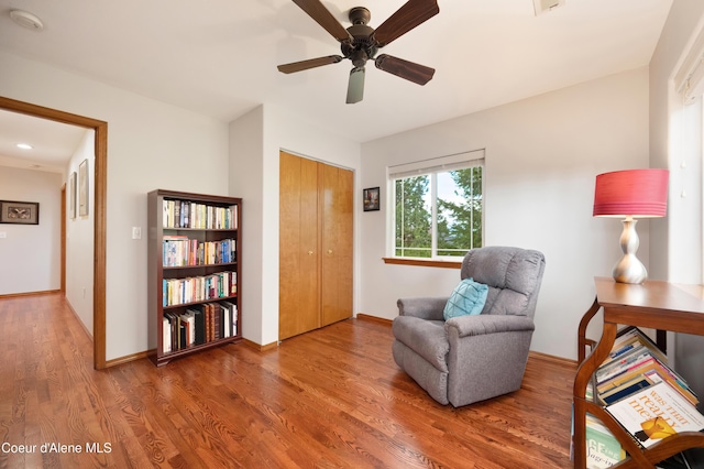 8533 N Tartan Dr, Hayden, ID 83835 - living area with wood finished floors, ceiling fan, and baseboards