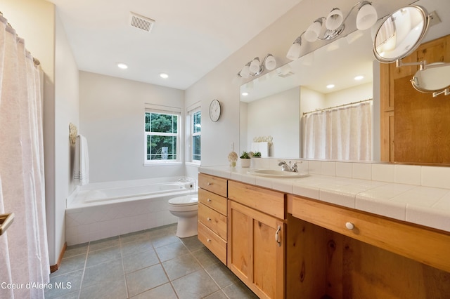 8533 N Tartan Dr, Hayden, ID 83835 - bathroom featuring tile patterned floors, a bath, vanity, toilet, and recessed lighting