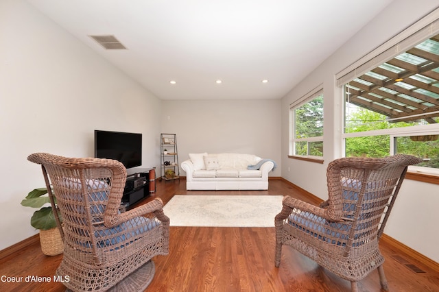 8533 N Tartan Dr, Hayden, ID 83835 - living area with wood finished floors, baseboards, and recessed lighting