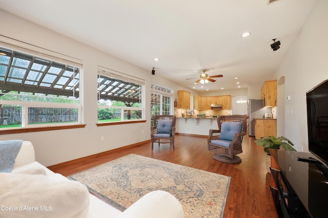 8533 N Tartan Dr, Hayden, ID 83835 - living area with ceiling fan, wood finished floors, recessed lighting, and baseboards