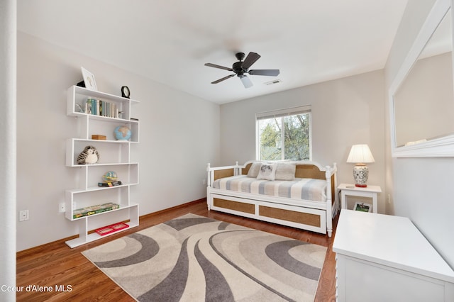8533 N Tartan Dr, Hayden, ID 83835 - bedroom with wood finished floors, baseboards, and ceiling fan