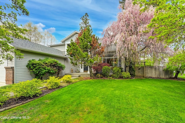 8533 N Tartan Dr, Hayden, ID 83835 - view of yard featuring a garage