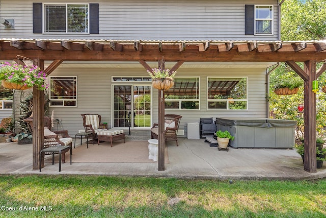 8533 N Tartan Dr, Hayden, ID 83835 - view of patio featuring a hot tub and a pergola