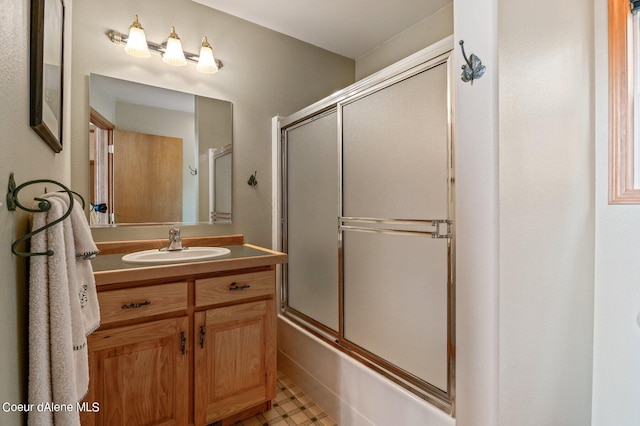 full bath with vanity, combined bath / shower with glass door, and tile patterned floors