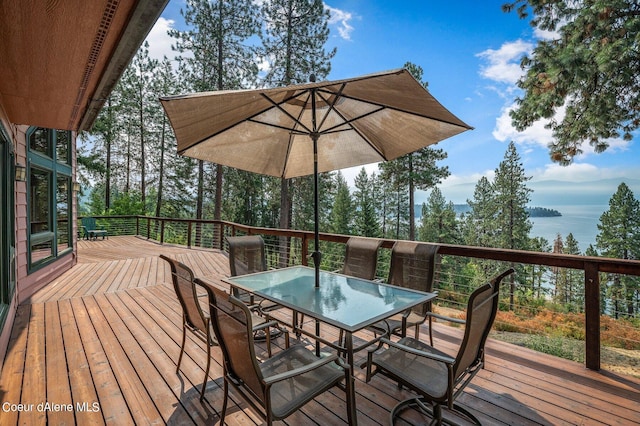wooden terrace with outdoor dining space
