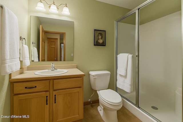 full bath with vanity, toilet, and a stall shower