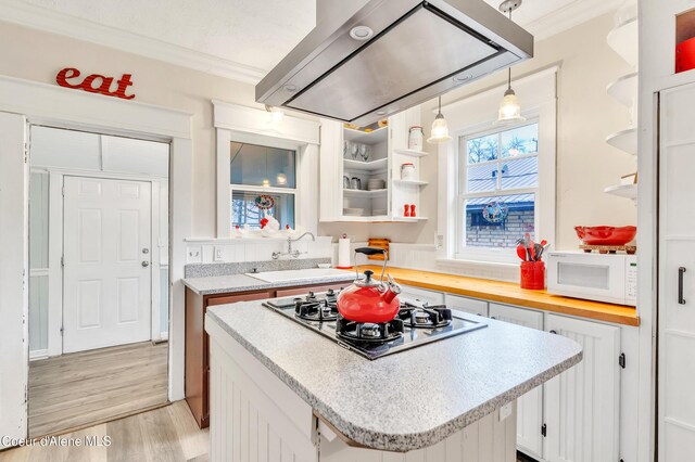 706 Main St, Sandpoint, ID 83864 - kitchen featuring open shelves, gas cooktop, a sink, extractor fan, and white microwave