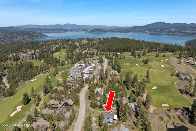 bird's eye view with a water and mountain view and golf course view