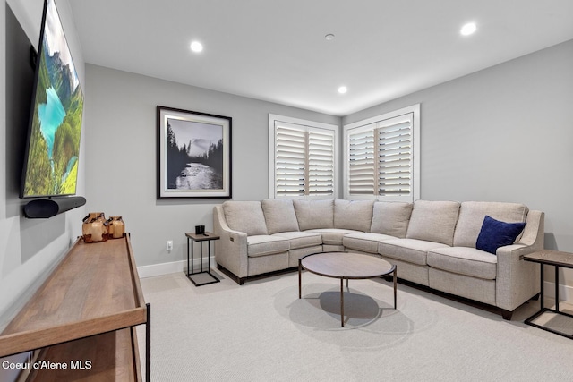 living area with carpet flooring, recessed lighting, and baseboards