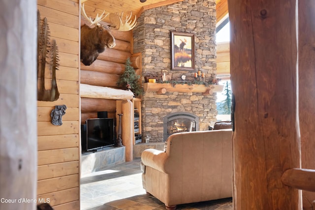 122 Makridge Ln, Kingston, ID 83839 - living room with rustic walls, lofted ceiling, a fireplace, wood ceiling, and stone finish flooring