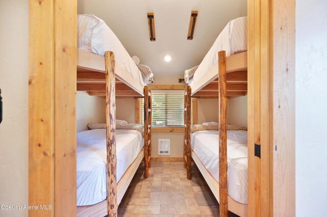 122 Makridge Ln, Kingston, ID 83839 - unfurnished bedroom featuring stone finish floor, recessed lighting, and visible vents
