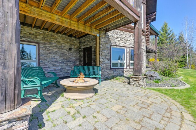 122 Makridge Ln, Kingston, ID 83839 - view of patio / terrace with an outdoor fire pit