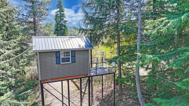 122 Makridge Ln, Kingston, ID 83839 - view of outdoor structure featuring a view of trees and an outbuilding
