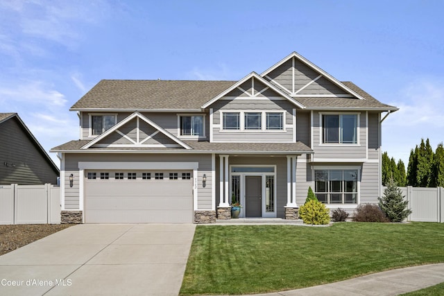 9362 N Prince William Loop, Hayden, ID 83835 - craftsman inspired home with driveway, stone siding, and a shingled roof