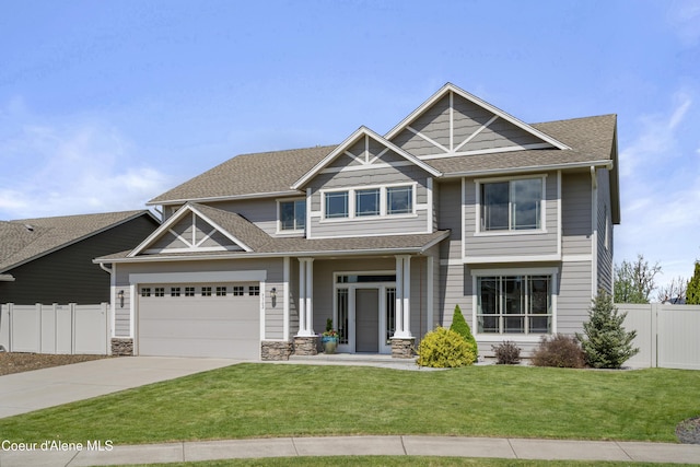 9362 N Prince William Loop, Hayden, ID 83835 - craftsman house with driveway, a shingled roof, a garage, and stone siding