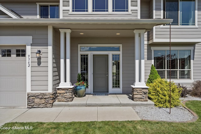 9362 N Prince William Loop, Hayden, ID 83835 - entrance to property with a porch and stone siding