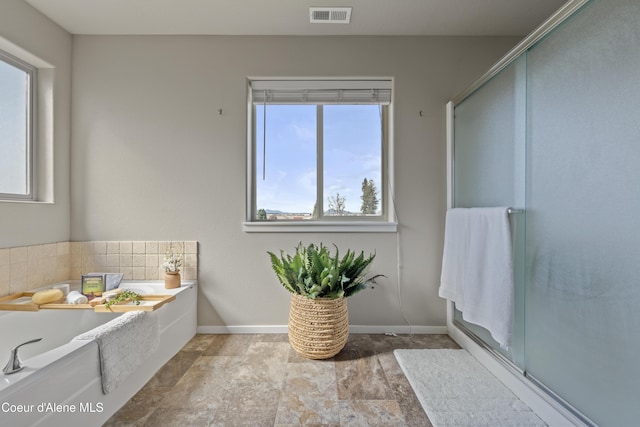 9362 N Prince William Loop, Hayden, ID 83835 - bathroom with plenty of natural light, a shower stall, and a garden tub