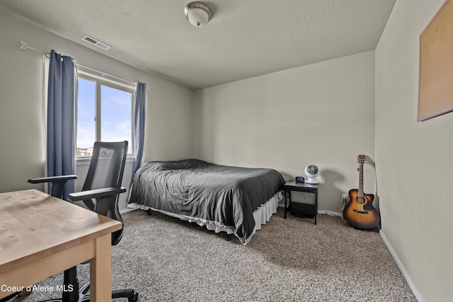 9362 N Prince William Loop, Hayden, ID 83835 - bedroom with carpet floors, a textured ceiling, and baseboards