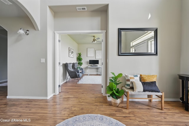 9362 N Prince William Loop, Hayden, ID 83835 - corridor featuring arched walkways, wood finished floors, and baseboards
