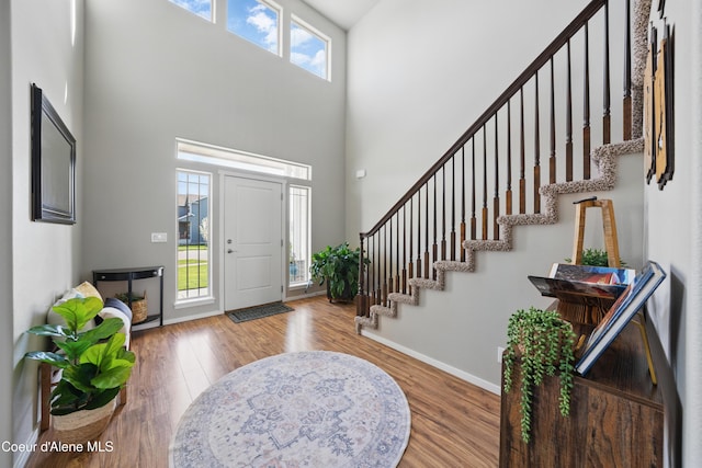9362 N Prince William Loop, Hayden, ID 83835 - entrance foyer with a towering ceiling, wood finished floors, stairway, and baseboards