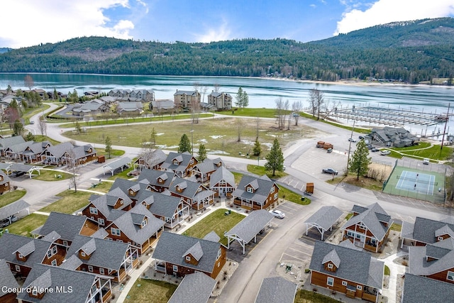 17 Hitchcock Dr, Dover, ID 83825 - aerial perspective of suburban area with a heavily wooded area and a water and mountain view