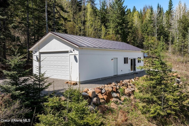 247 Living Waters Way, Priest River, ID 83856 - detached garage featuring a view of trees
