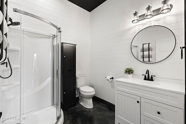 247 Living Waters Way, Priest River, ID 83856 - bathroom with vanity, concrete floors, a stall shower, and toilet