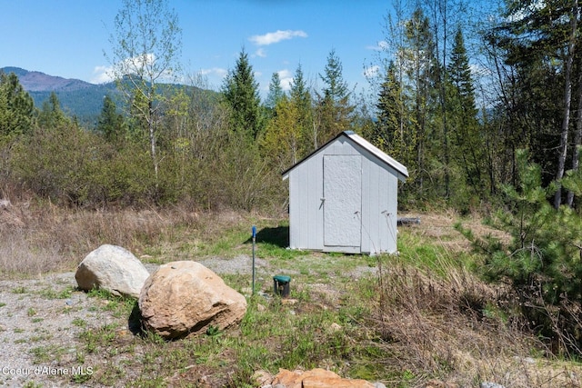 247 Living Waters Way, Priest River, ID 83856 - view of shed featuring a mountain view and a wooded view