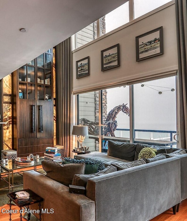 412 Sandpoint Ave Unit 332, Sandpoint, ID 83864 - living room featuring a high ceiling and wood finished floors