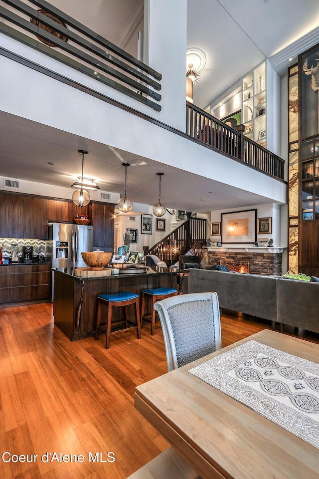 412 Sandpoint Ave Unit 332, Sandpoint, ID 83864 - dining space featuring a high ceiling, light wood-type flooring, and visible vents