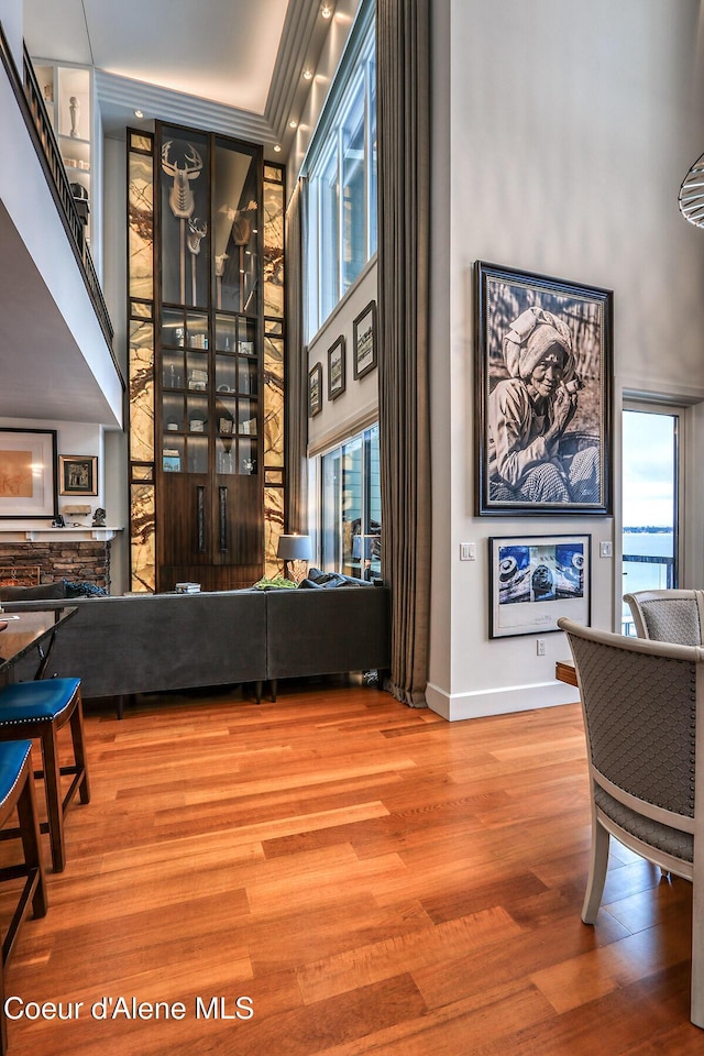 412 Sandpoint Ave Unit 332, Sandpoint, ID 83864 - living area featuring plenty of natural light, baseboards, a high ceiling, and wood finished floors