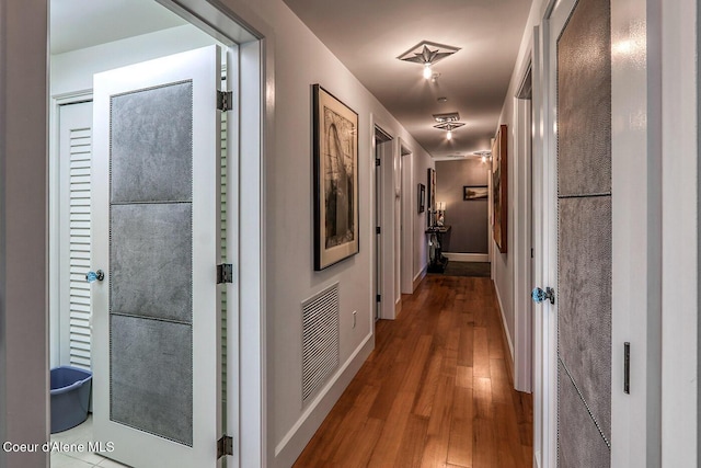 412 Sandpoint Ave Unit 332, Sandpoint, ID 83864 - corridor with baseboards, wood finished floors, and visible vents