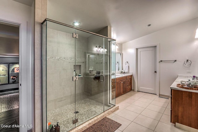 412 Sandpoint Ave Unit 332, Sandpoint, ID 83864 - full bath featuring vanity, a shower stall, tile patterned floors, and lofted ceiling