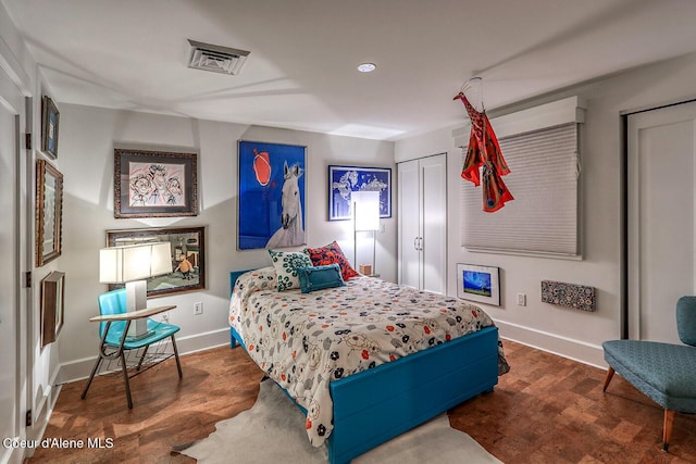 412 Sandpoint Ave Unit 332, Sandpoint, ID 83864 - bedroom featuring baseboards, wood finished floors, and visible vents