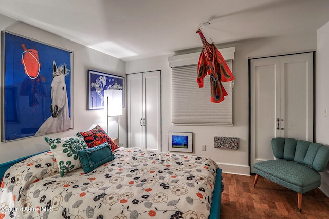 412 Sandpoint Ave Unit 332, Sandpoint, ID 83864 - bedroom featuring multiple closets, baseboards, and wood finished floors