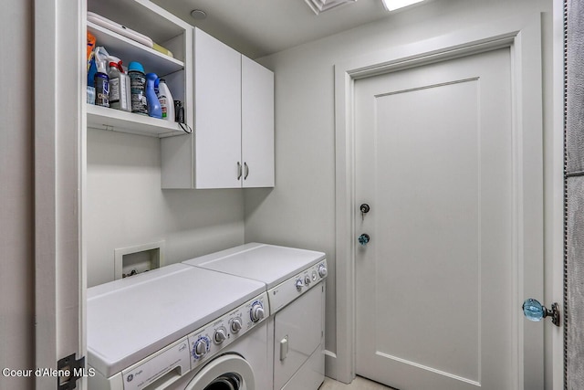 412 Sandpoint Ave Unit 332, Sandpoint, ID 83864 - clothes washing area featuring cabinet space and washer and clothes dryer