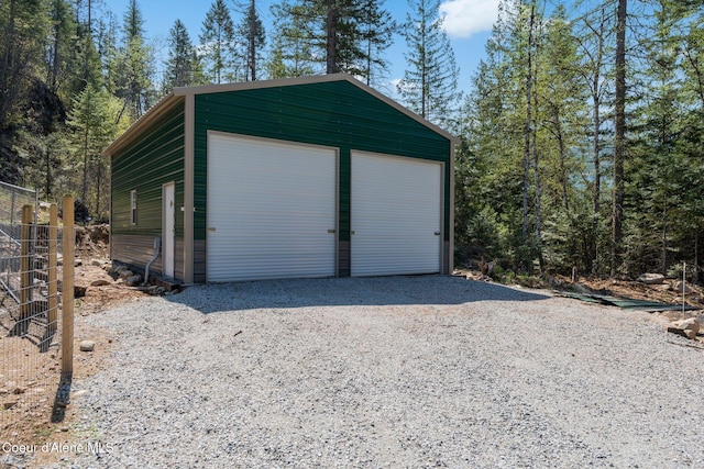 detached garage with fence