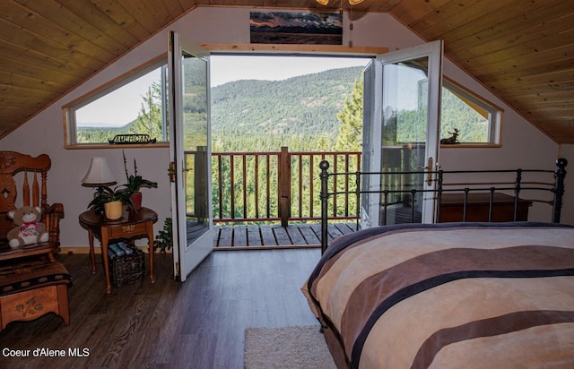 bedroom featuring vaulted ceiling, wooden ceiling, and wood finished floors