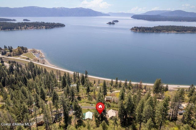 bird's eye view with a water and mountain view